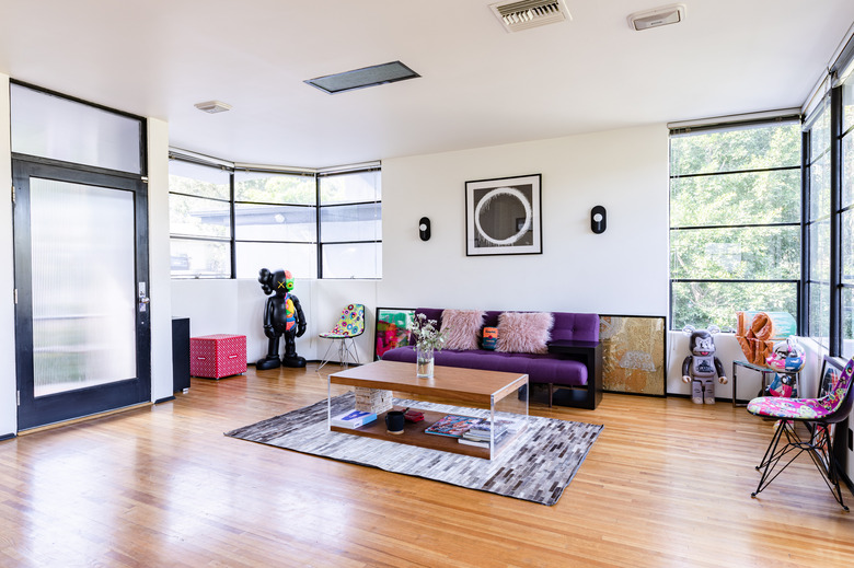 modern living room with colorful furniture and wood floors