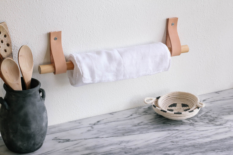 DIY unpaper towels hanging on wood and leather wall holder