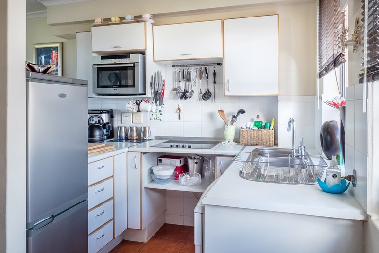 Kitchen with white countertops and cupboards