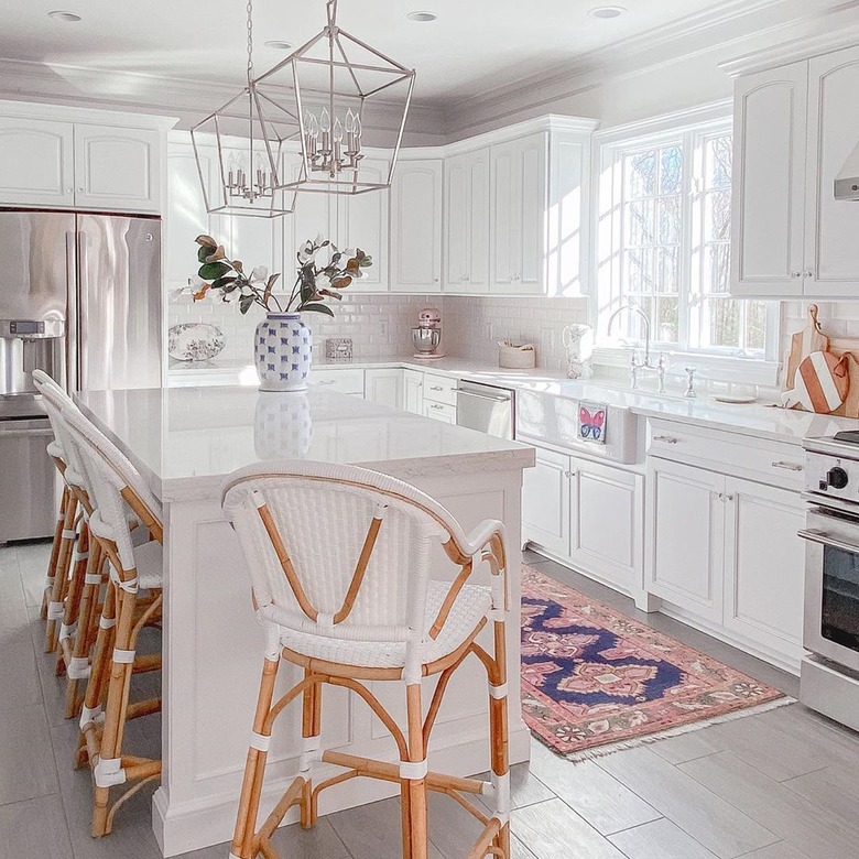 navy and pink rug for kitchen floor in all-white traditional kitchen