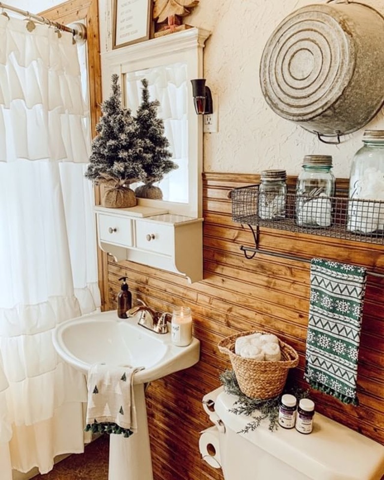 bathroom with wood backsplash and white sink