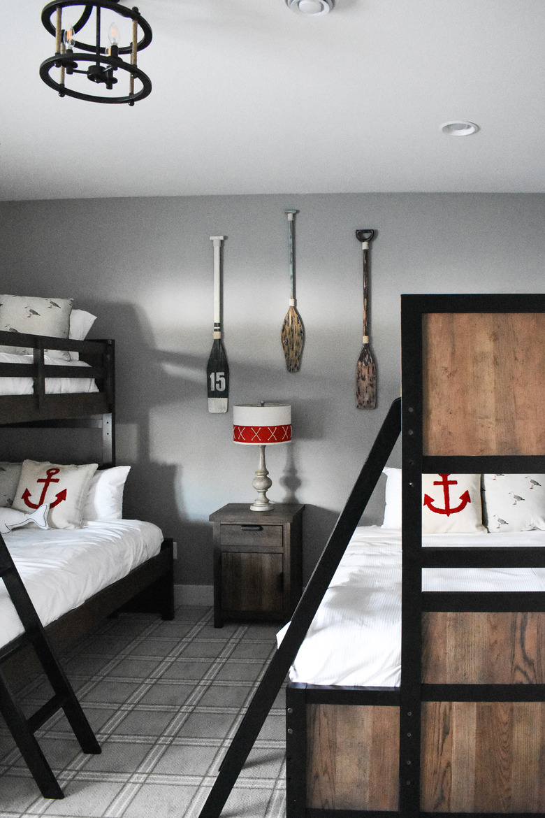 rustic beach decor in gray bedroom with paddes and bunkbeds