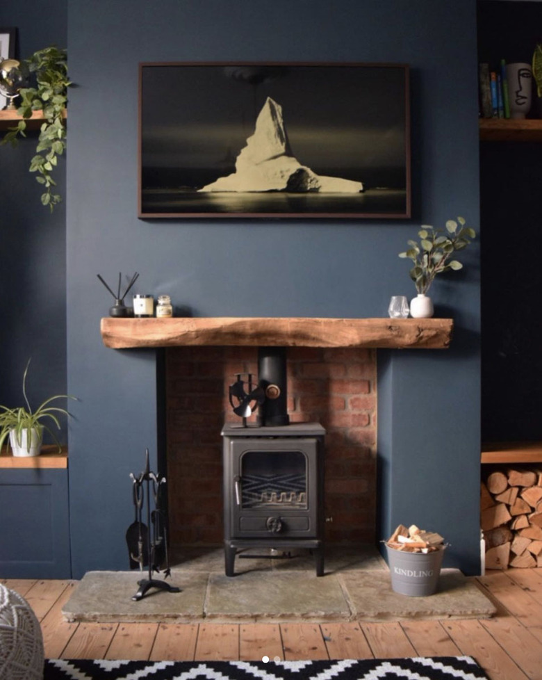 Rustic blue living room with fireplace and wood floor