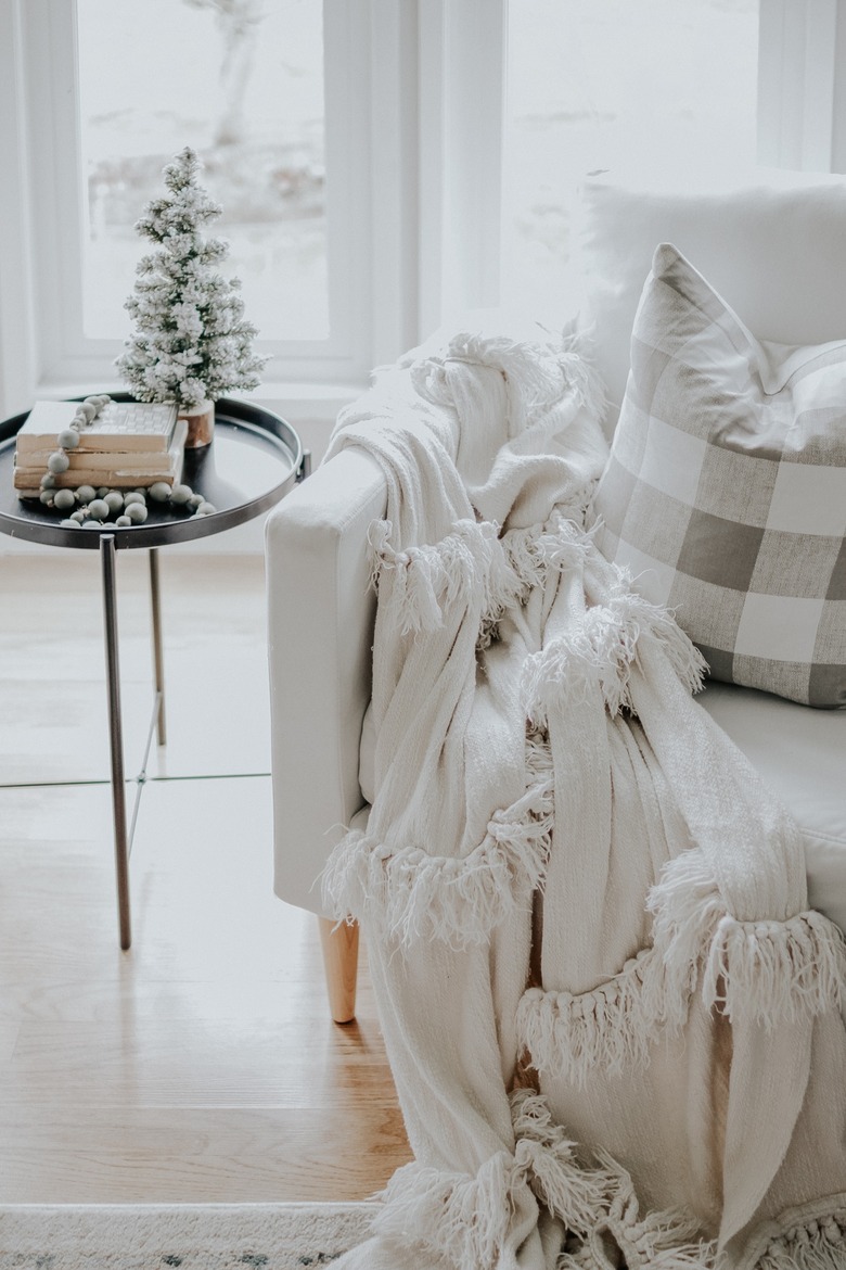 Rustic Christmas decorations in natural colors with living room chair and side table