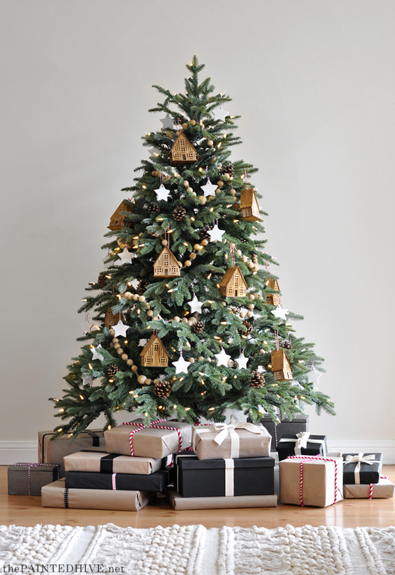 Rustic Christmas tree with wooden house ornaments and wood beaded garland