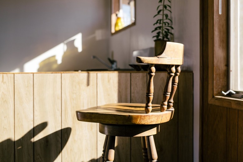 rustic decor in room with a frontier-style rustic wooden chair