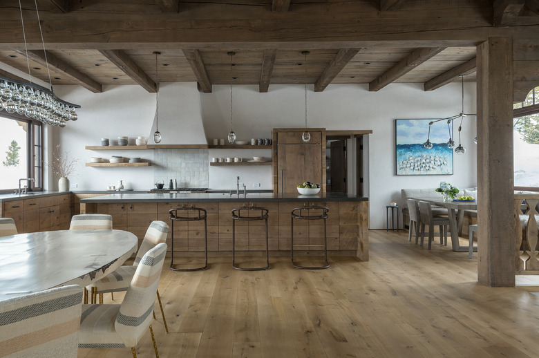 long wooden rustic kitchen island in wooden kitchen