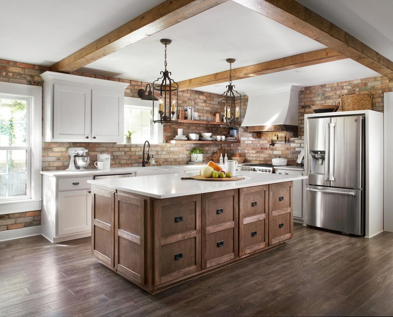 white rustic kitchen island with wooden beams and wooden island