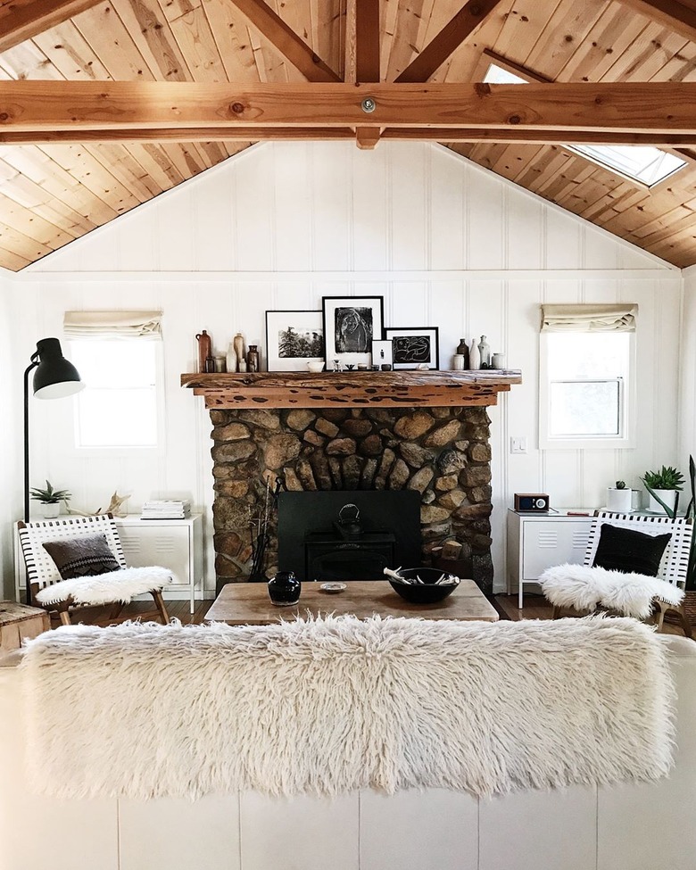 Living Room lighting idea with industrial floor lamp near stone fireplace