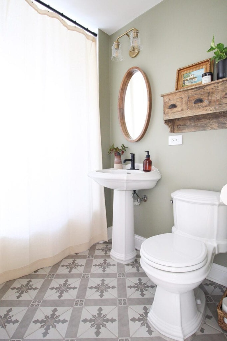 Minimalist bathroom with sage color walls and patterned floor tile