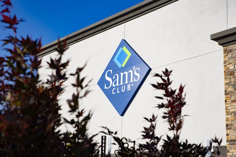 Exterior of a Sam's Club partially blocked by a tree