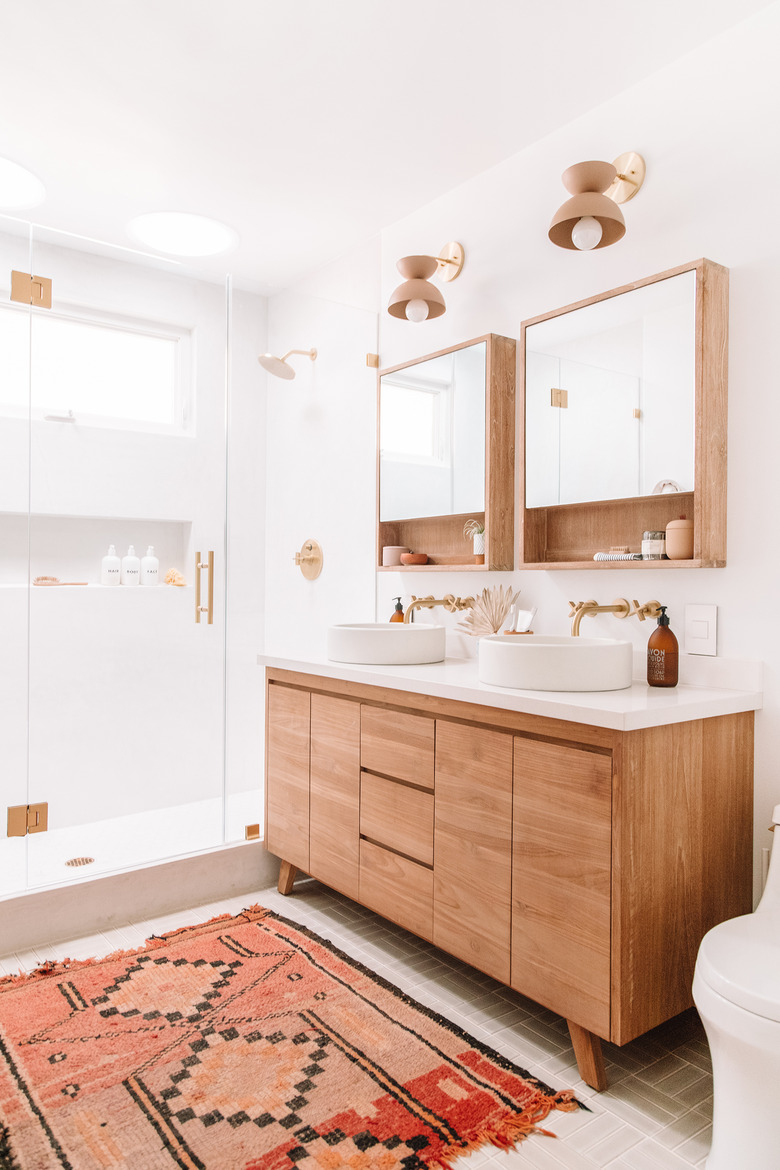 Scandinavian bathroom vanity in teak with pink and red rug