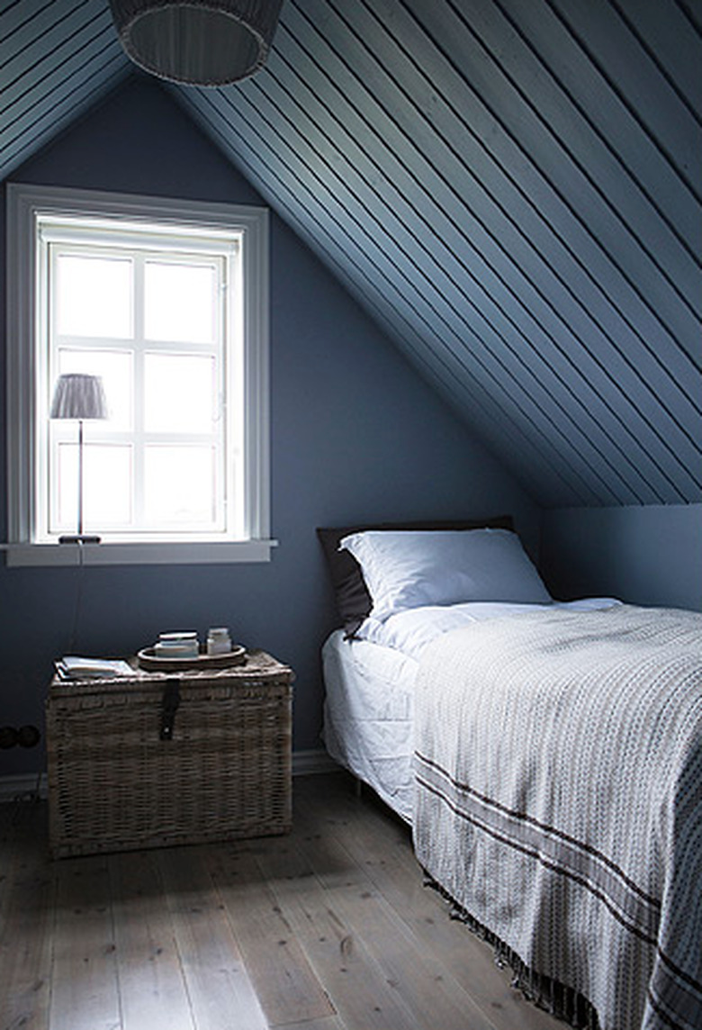 Scandinavian bedroom idea with dark bluish-gray room with A-frame tongue and groove ceiling