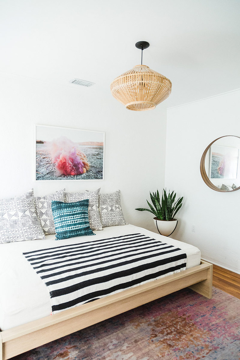 white Scandinavian boho bedroom with boho accents