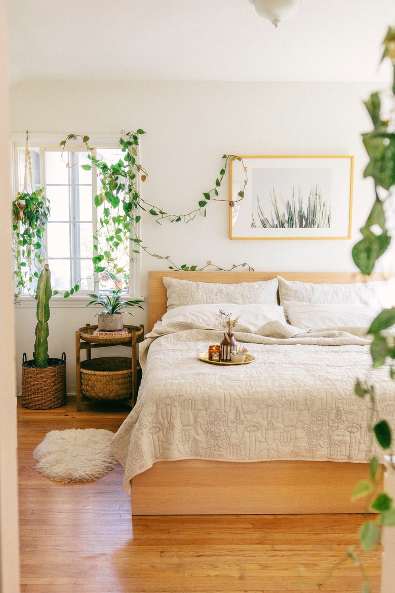 Scandinavian boho bedroom with natural greenery