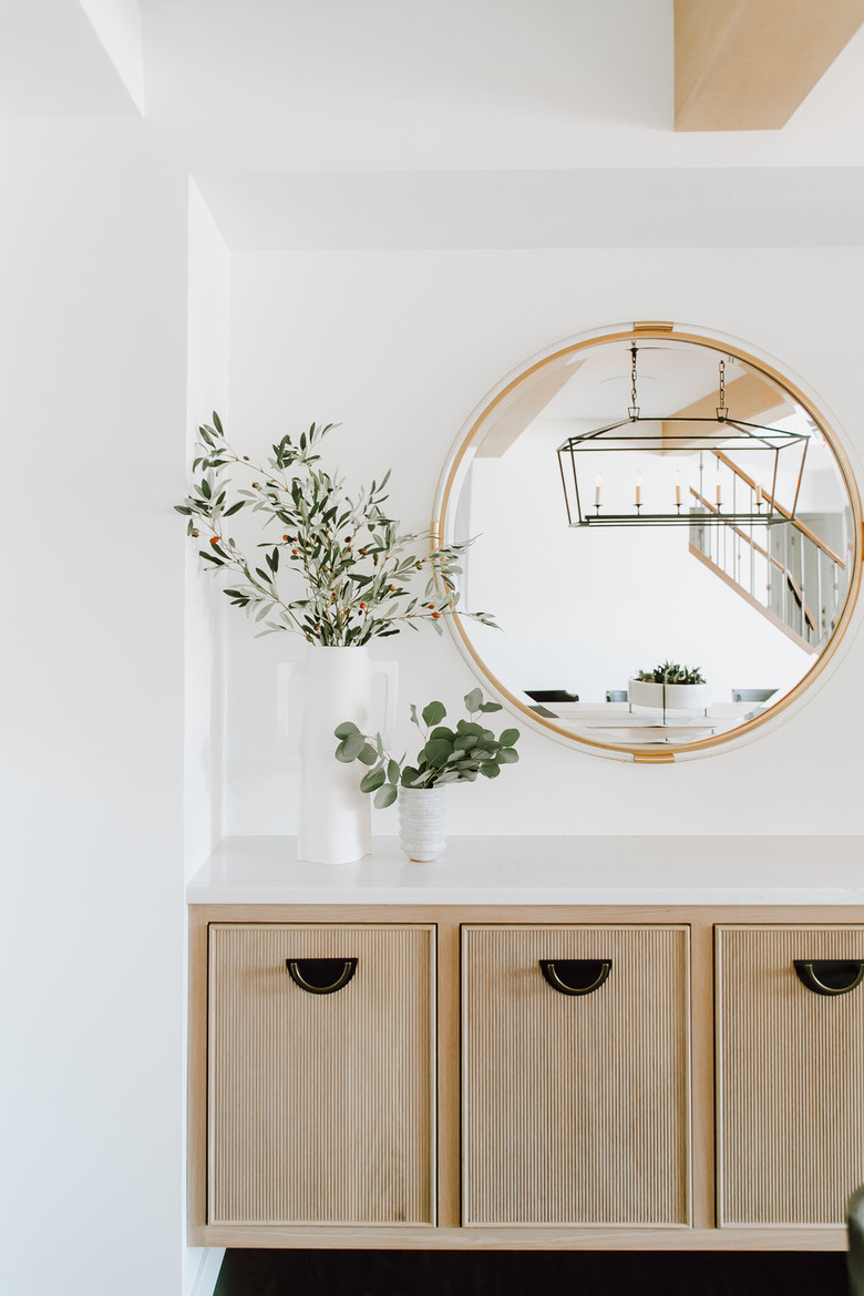 scandinavian hallway with round mirror