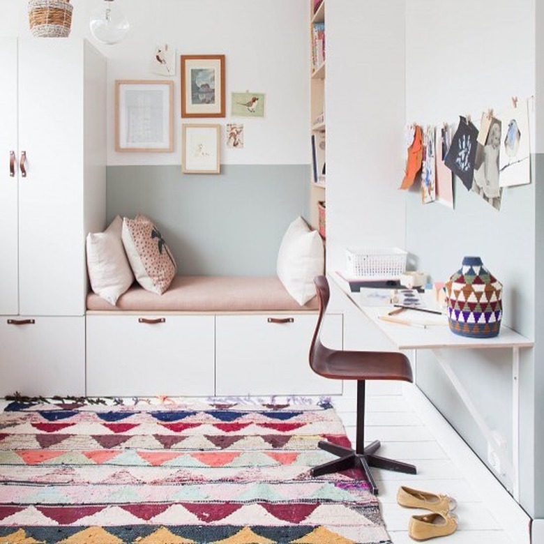 Scandinavian kids bedroom idea with  leather pulls on white built-in cabinets