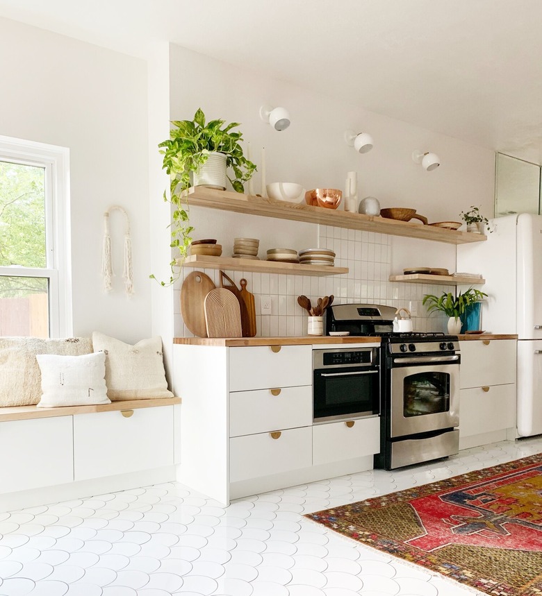 white scandinavian kitchen with colorful area rug