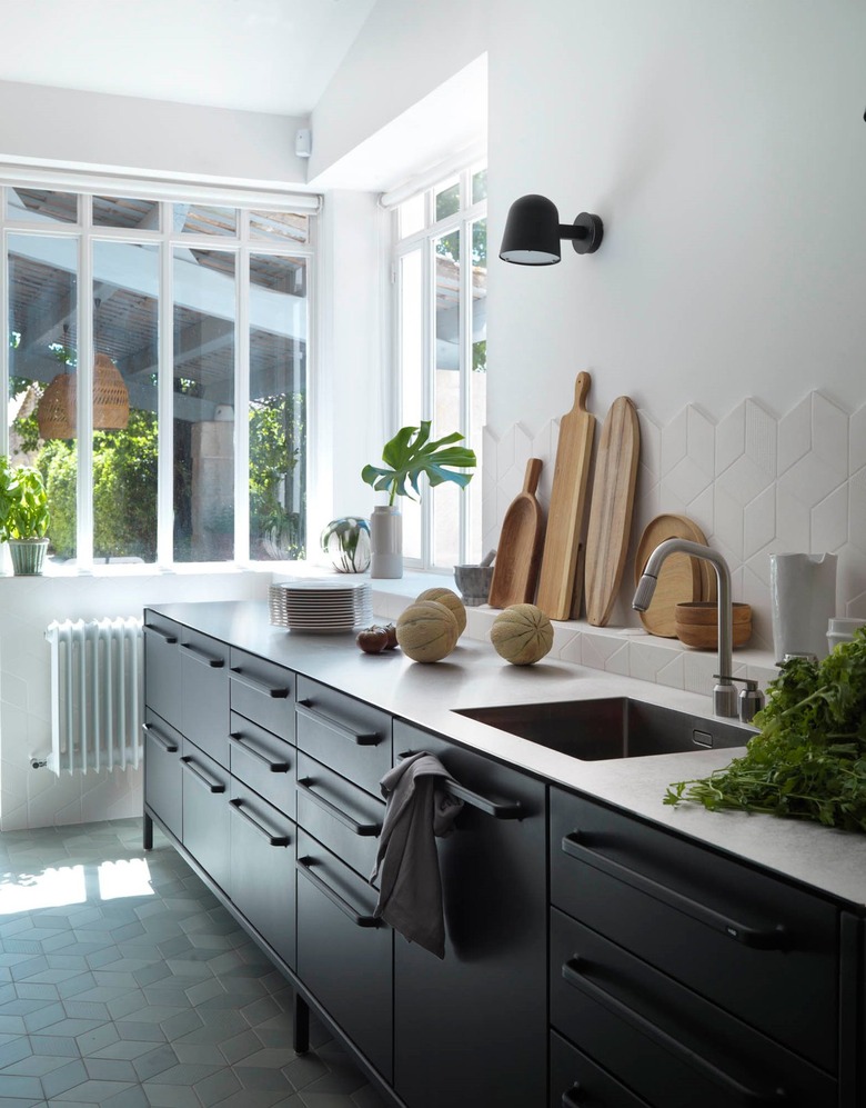 scandinavian kitchen with dark black cabinets