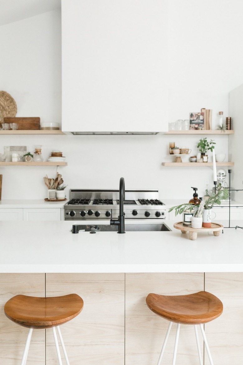 White boho kitchen with large island and professional range