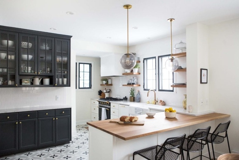 Scandinavian kitchen floor tile with black and white, paired with black cabinets