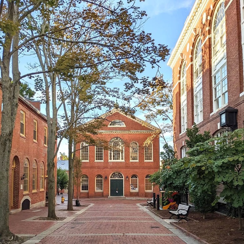 Brick buildings surrounding a brick square in Salem, MA.