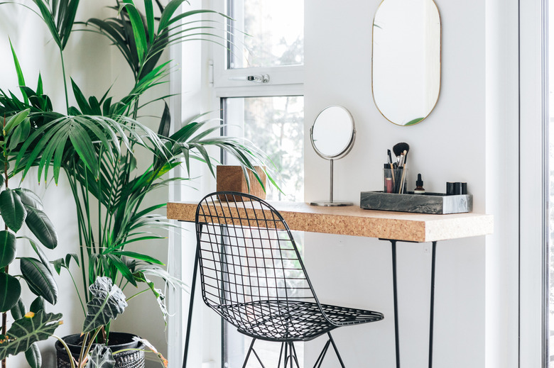 A corner of the modern, stylish and bright bedroom with plants