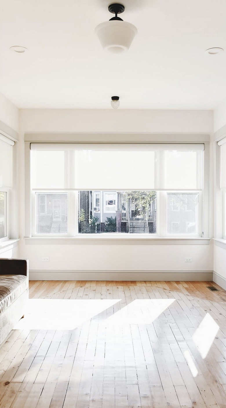 two semi-flush mount lights in white living room