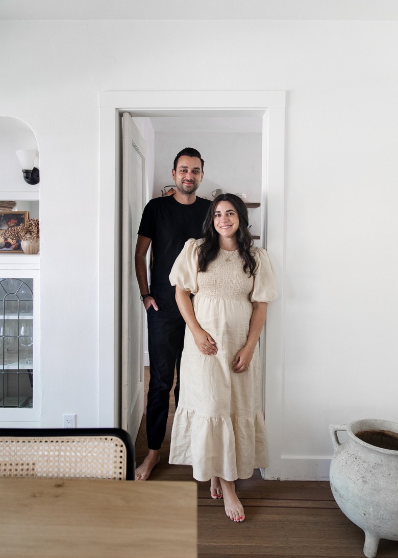 Couple in dining room.