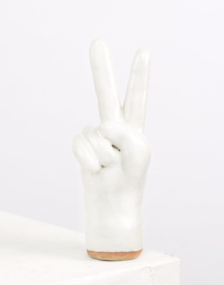 White ceramic peace sign.