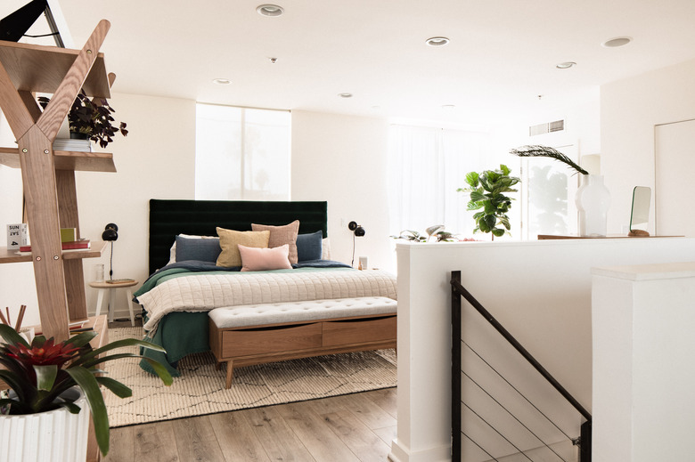 Hunker House bedroom with upholstered headboard and bed bench