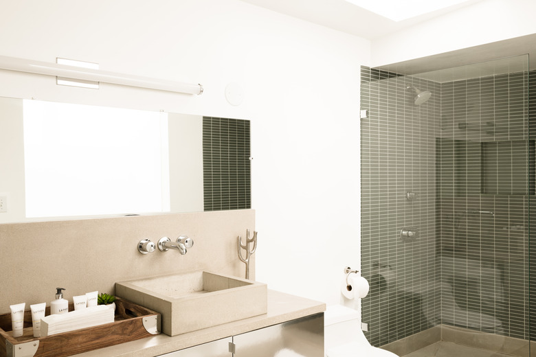 neutral-colored bathroom with shower with glass door