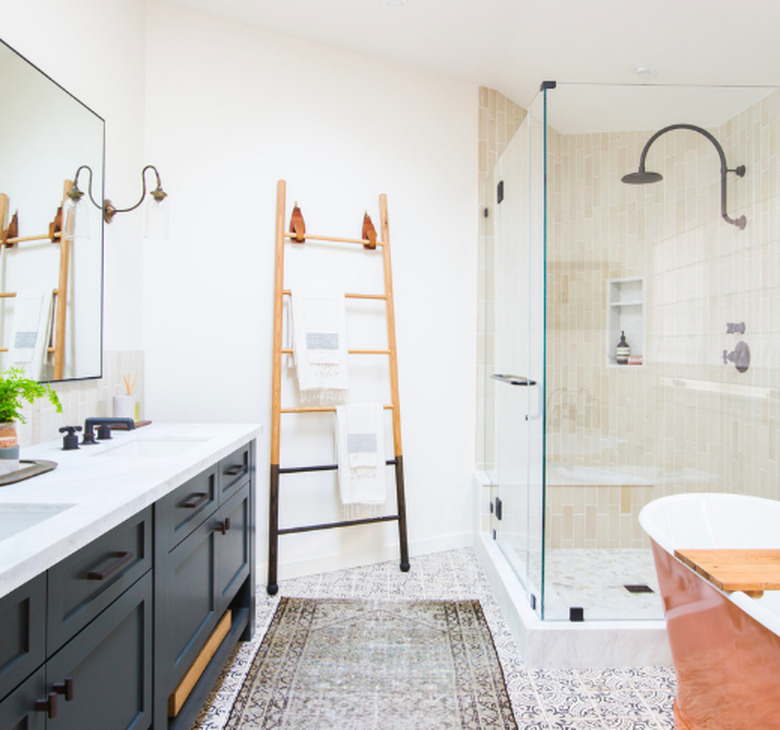 shower tile ideas in a standing shower with a black double vanity and patterened rug