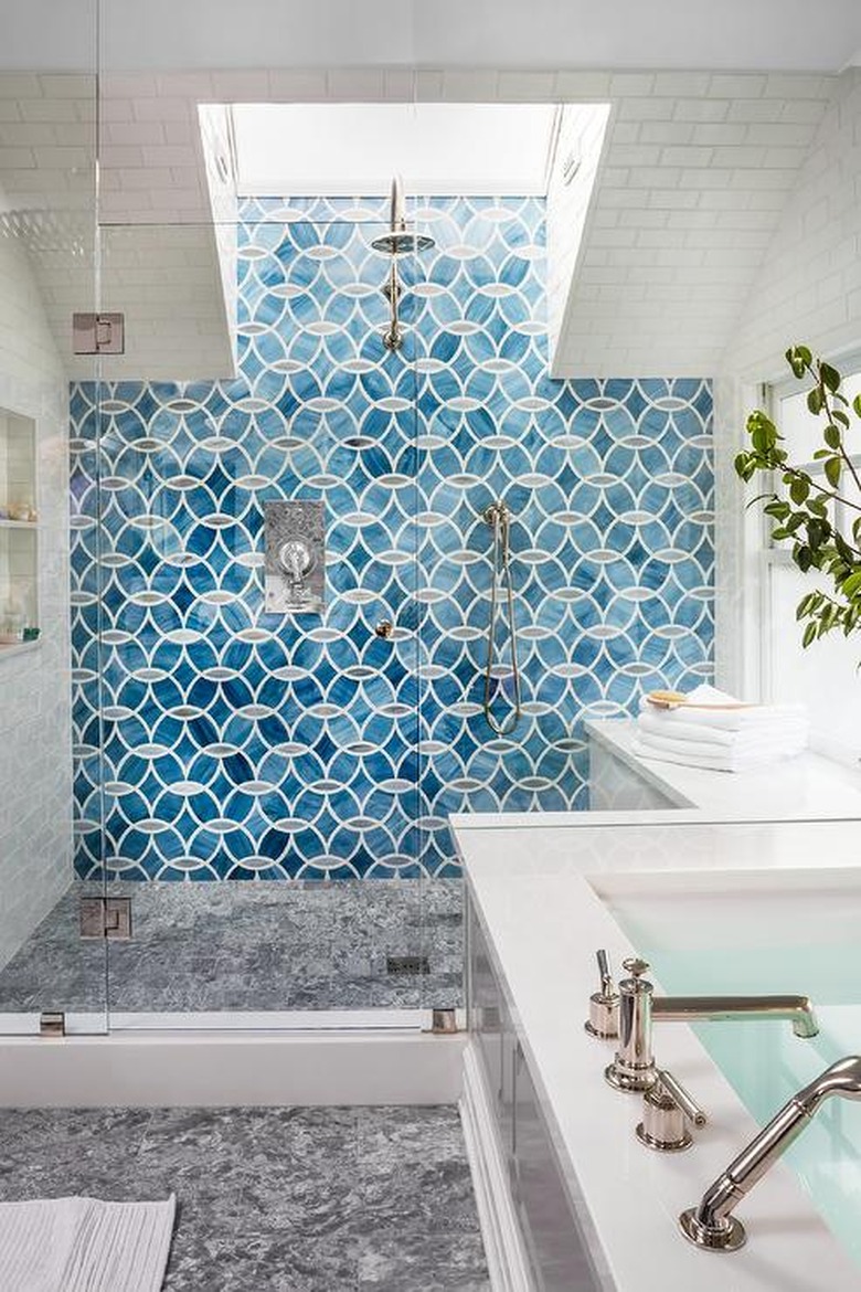 bright blue shower tile ideas in bathroom with skylight