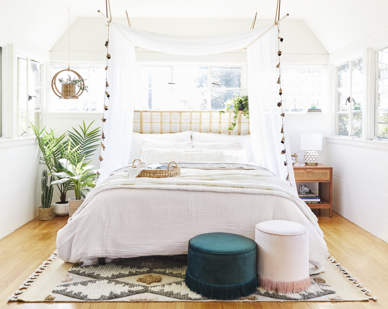 Small bedroom decorating idea with an ethereal canopy