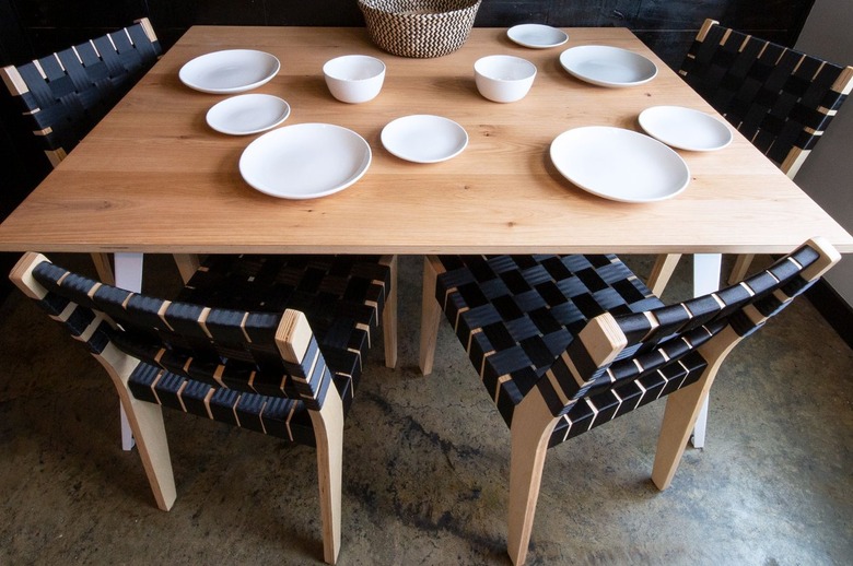 txtur black woven dining chairs at table