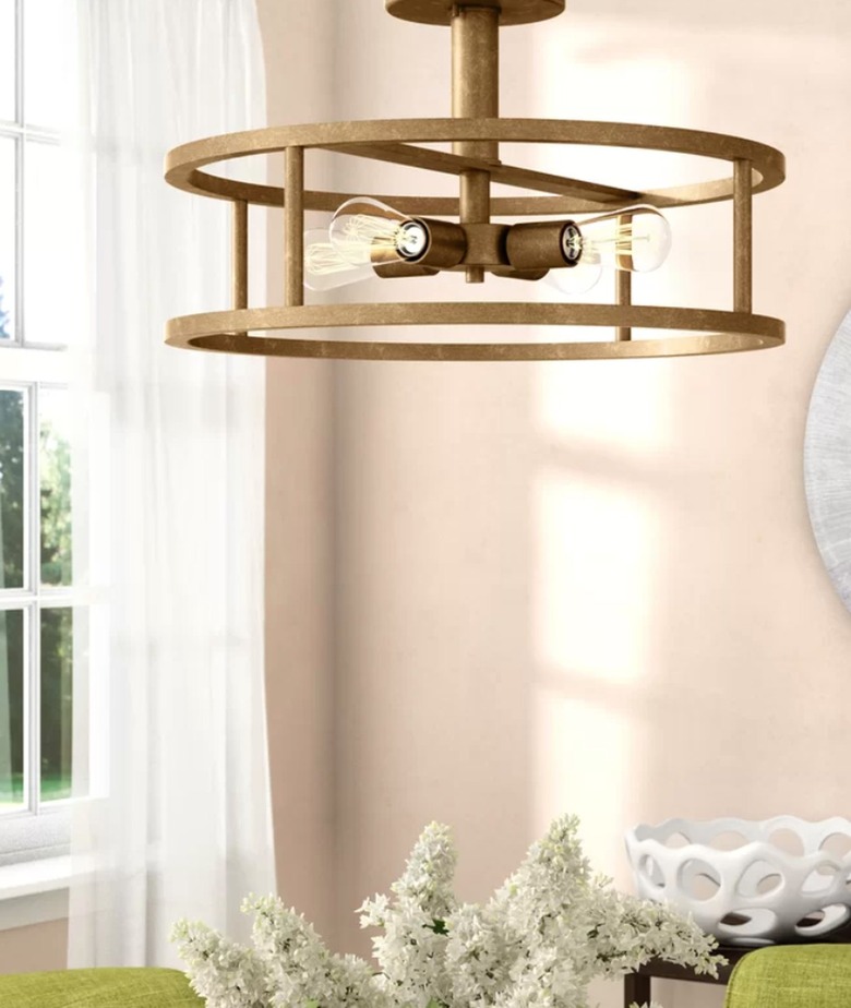 Brass open drum frame semi flush mount light.