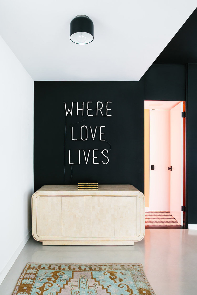 Entryway with neon sign by Black Lacquer Design