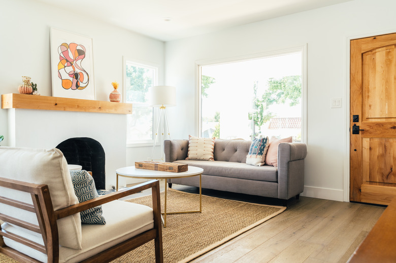 small living room with fireplace and large window