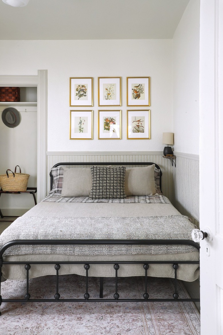 small vintage bed in corner with beadboard