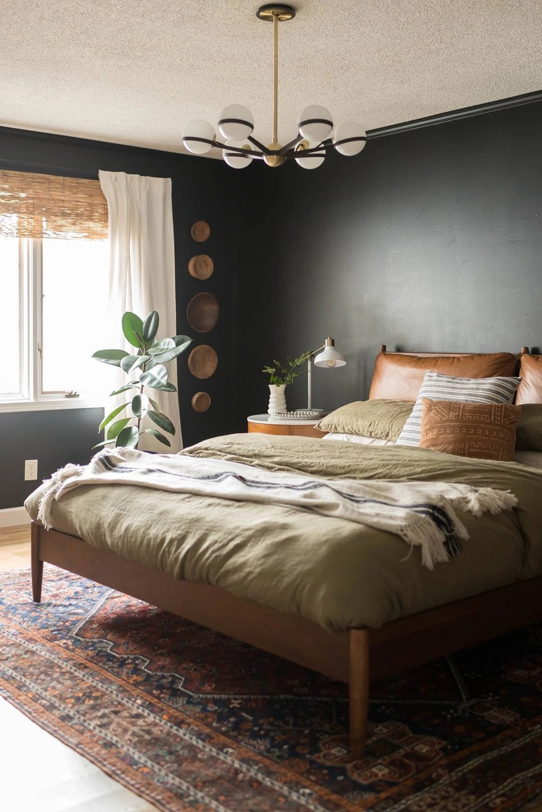 black small bedroom with wall baskets