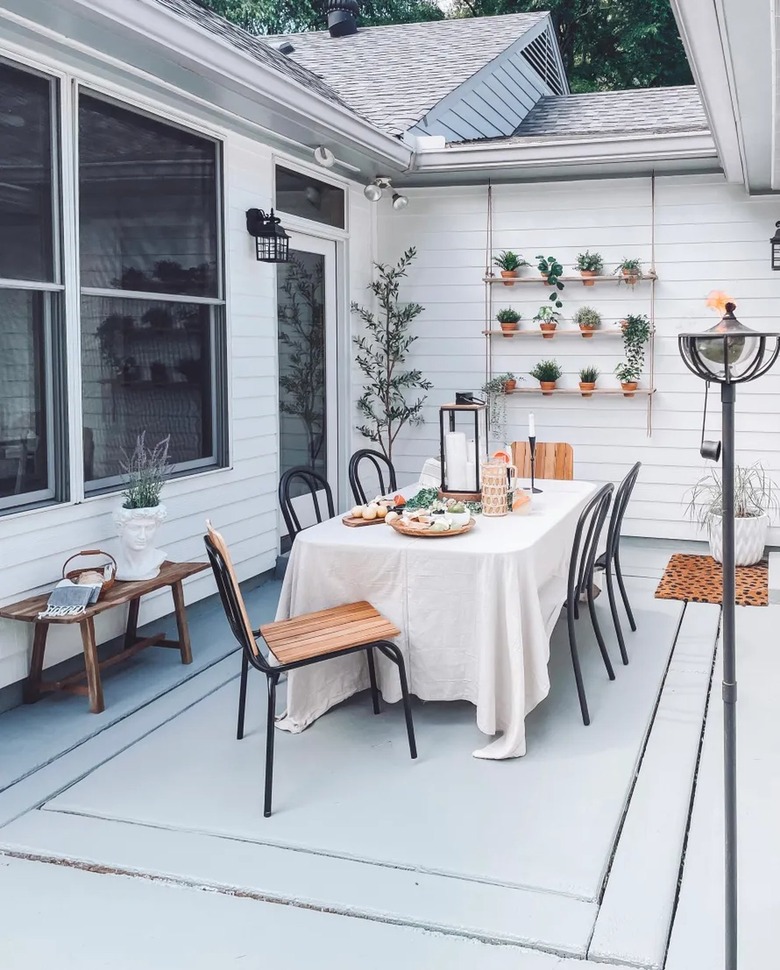 dining area on outdoor patio with vertical garden