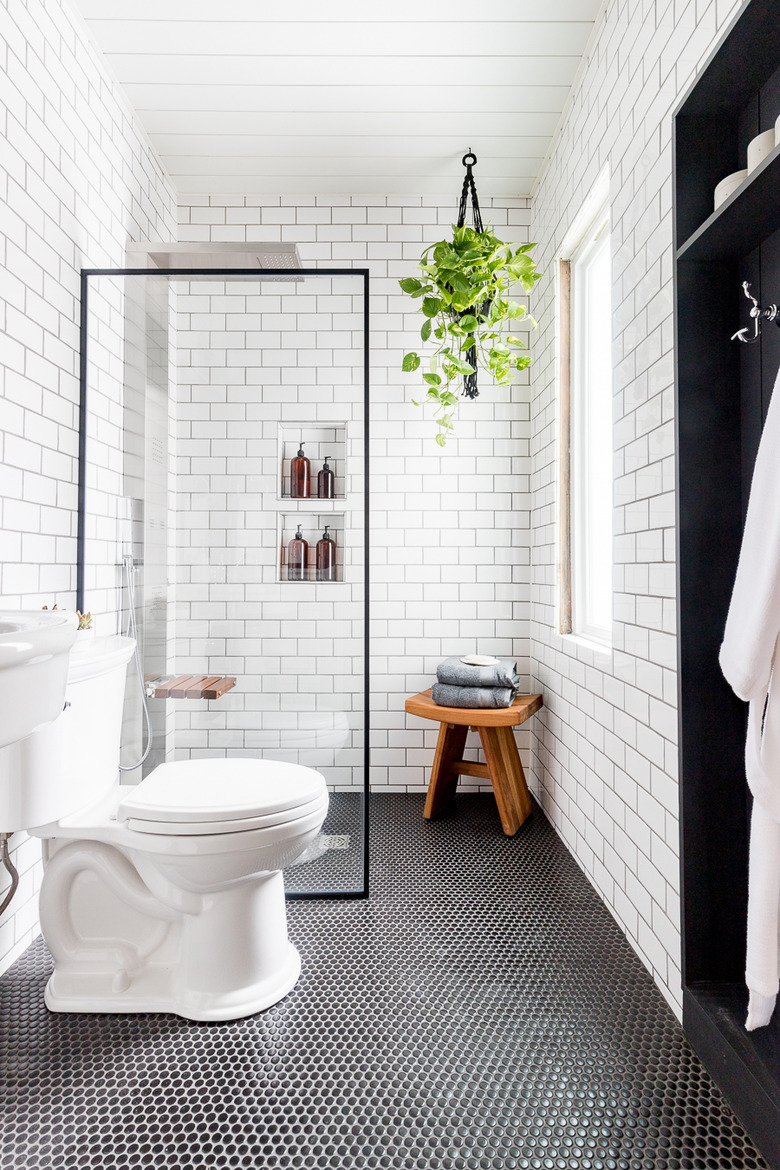 modern small shower idea with white subway tile and black shower screen