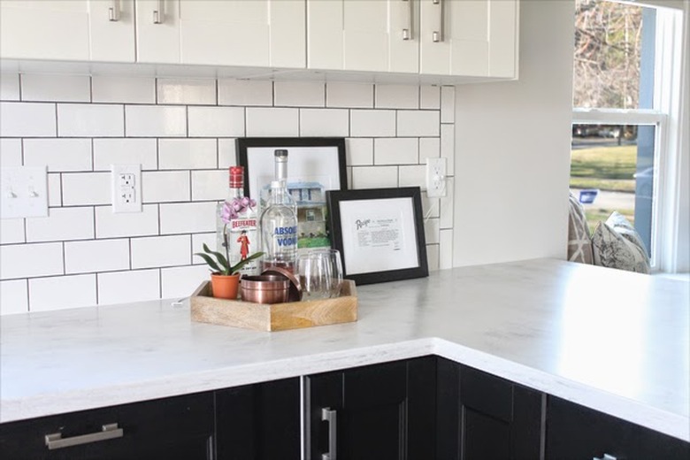 Black and white modern kitchen with with solid surface countertops