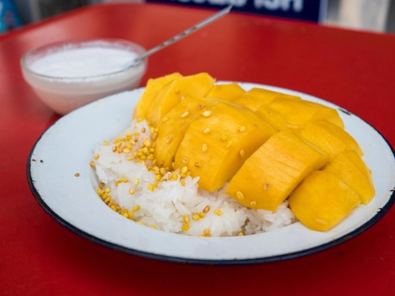 Eating Thai Food Khao Niew Mamuang (Mango Sticky Rice)