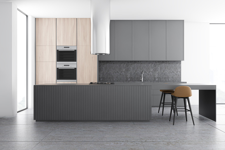 Gray and wooden kitchen interior with bar