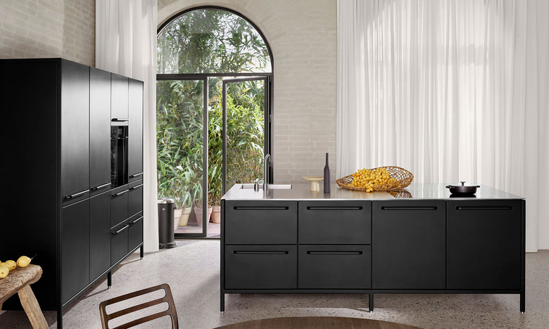 powder-coated stainless steel kitchen island in well-lit kitchen