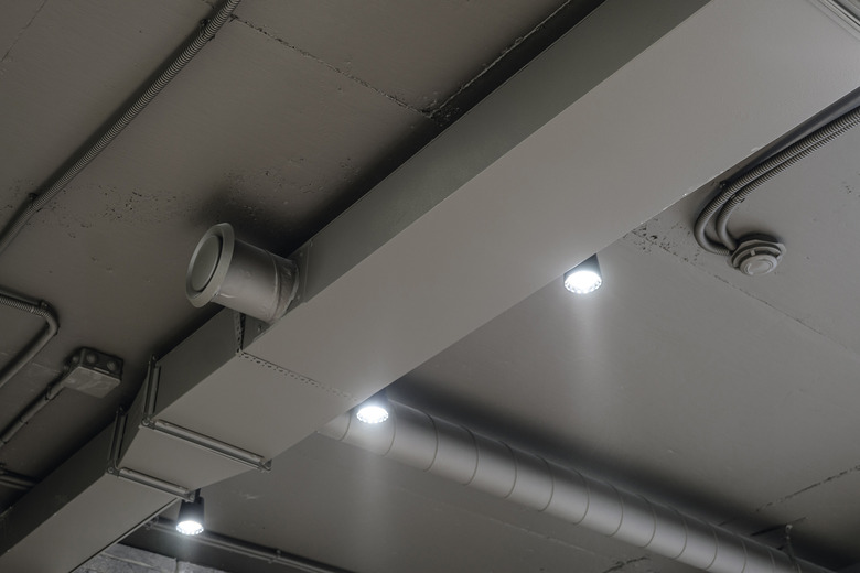 Ceiling ventilation ducts and LED lights. Engineering air system.