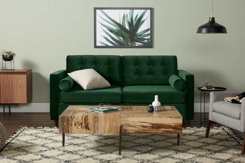 green velvet tufted sofa