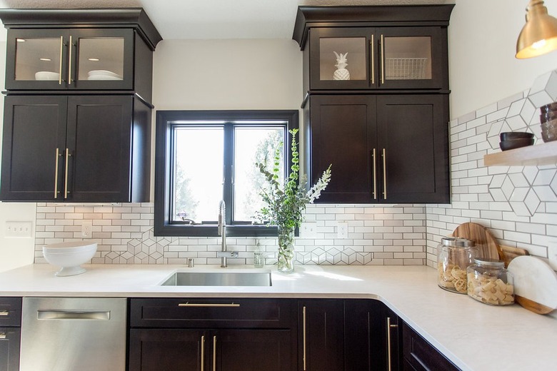 white subway tile backsplash with geometric tile shapes